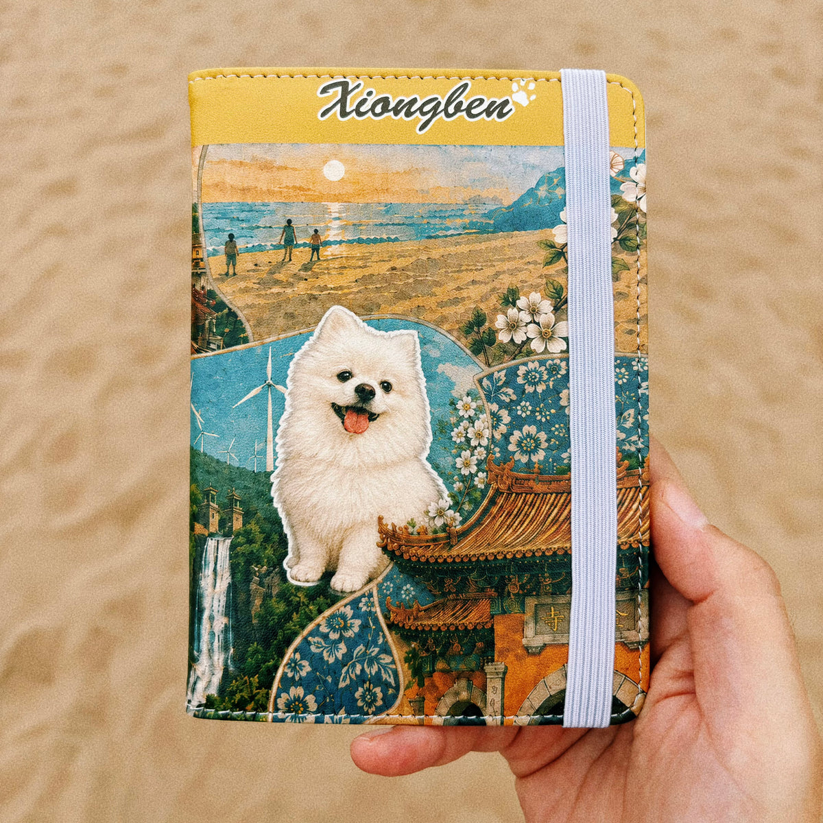 Hand holding a personalized pet travel wallet with a white Pomeranian collage cover