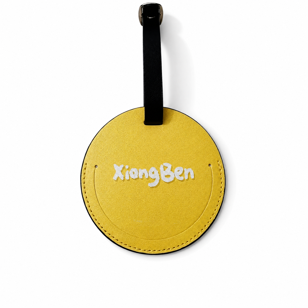 Front view of a yellow round personalized pet luggage tag with a white Pomeranian portrait